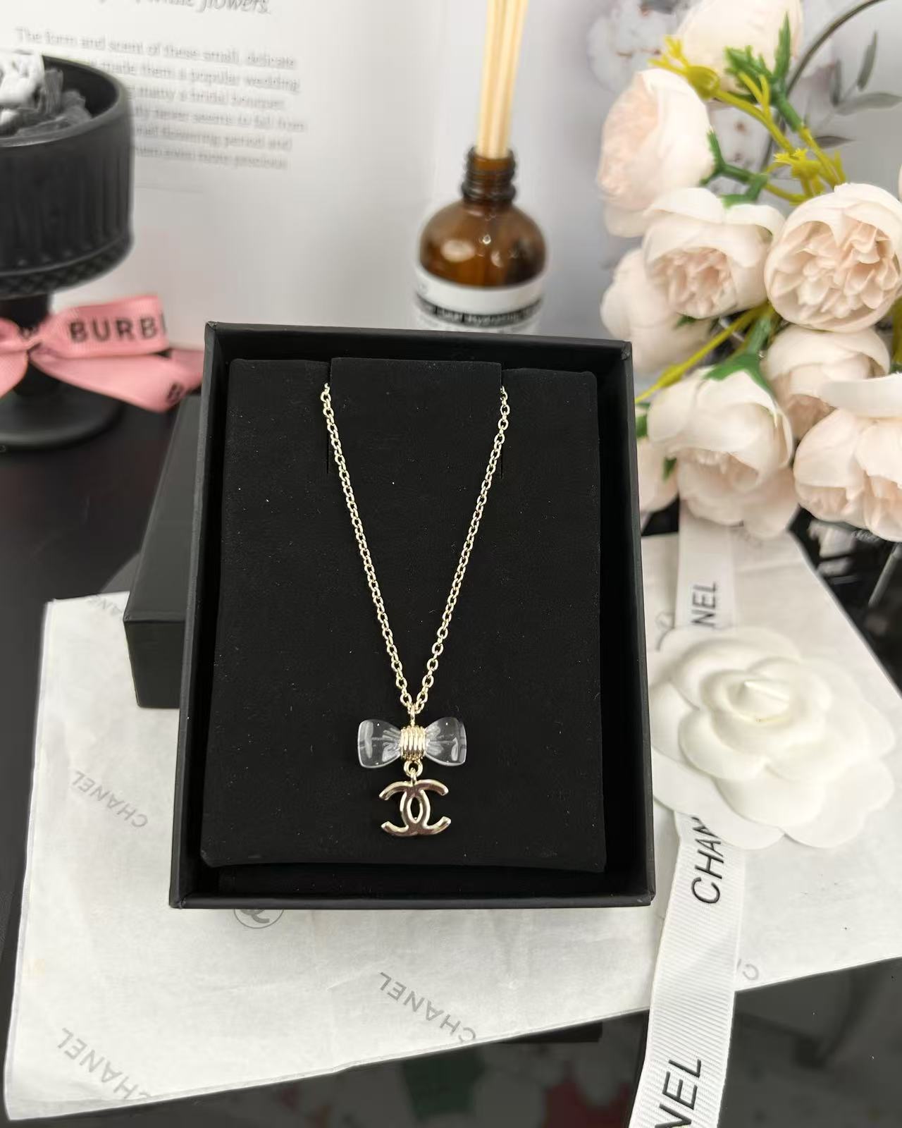replica Chanel Transparent Bow CC Pendant Necklace - H Lin Jewelry