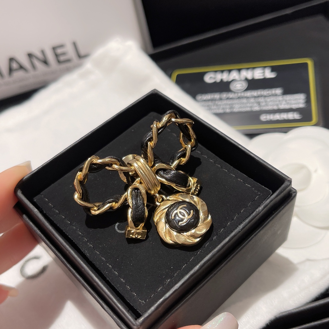 replica Chanel Black Leather Wrap Gold Bow Brooch - H Lin Jewelry