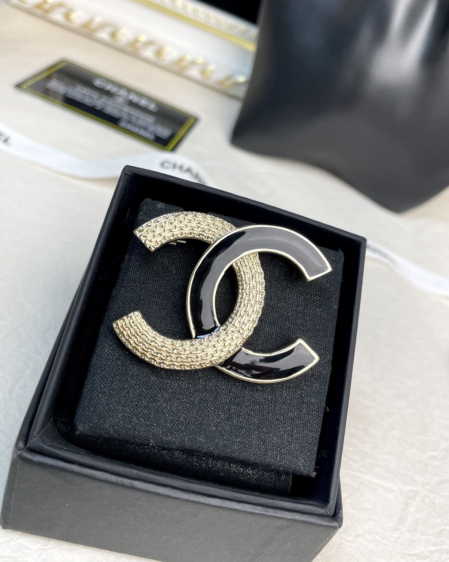 replica Black and Gold Chanel Brooch - H Lin Jewelry