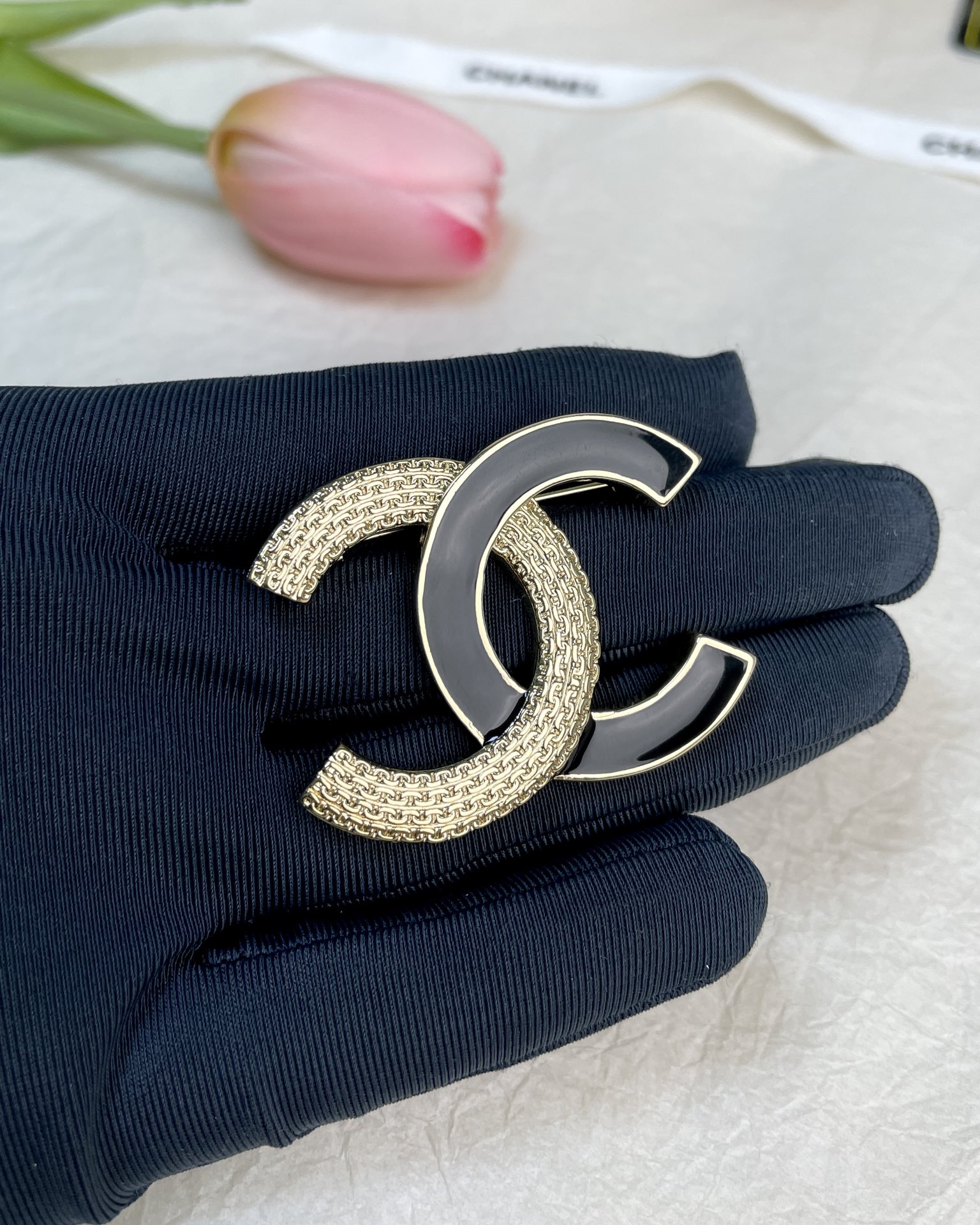 replica Black and Gold Chanel Brooch - H Lin Jewelry