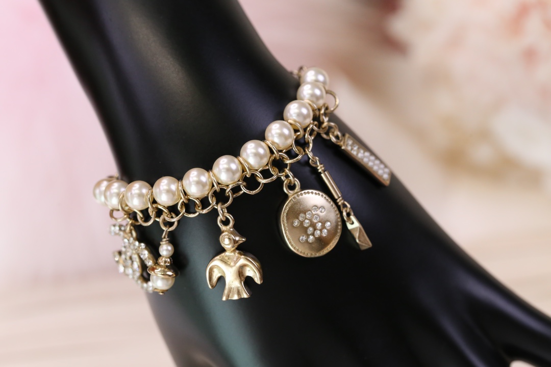 replica Chanel Bird CC Charms Chain Pearl Tassel Bracelet - H Lin Jewelry