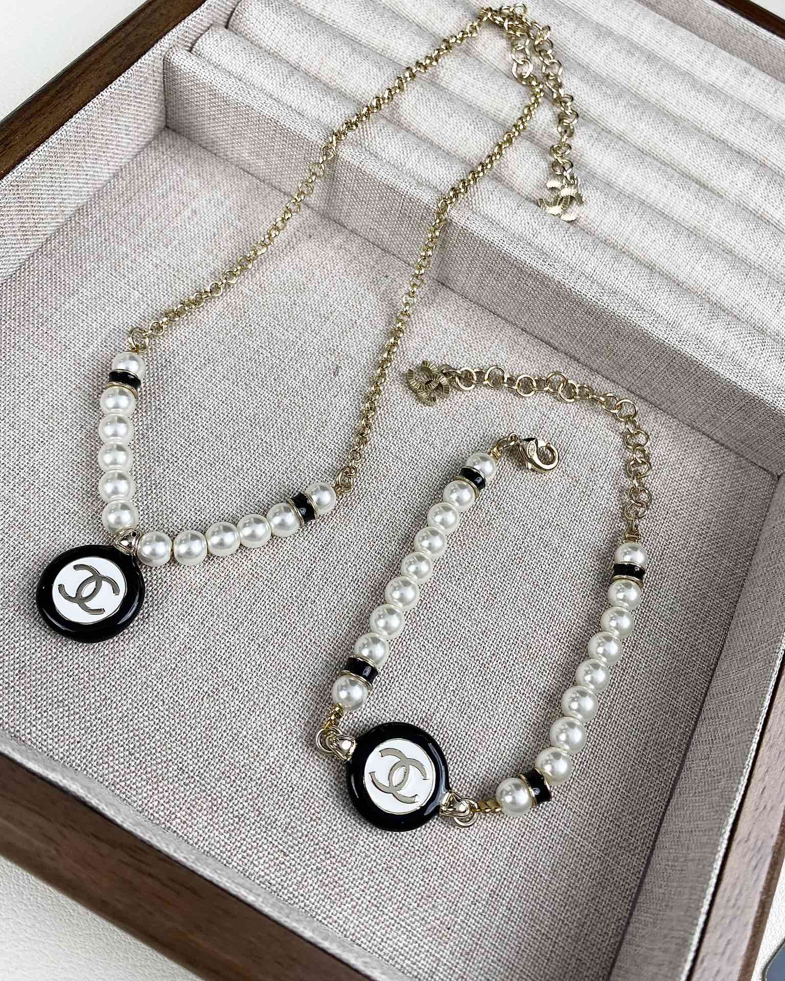 replica Chanel Black and White Round Charm Pearl Bracelet Necklace - H Lin Jewelry