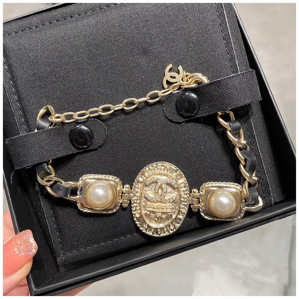replica Chanel Vintage Light Gold Oval Tag Bracelet - H Lin Jewelry