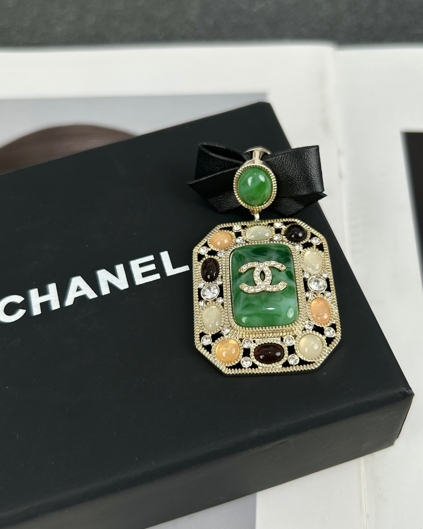 replica Chanel Leather Bow Multigem Emerald Brooch - H Lin Jewelry