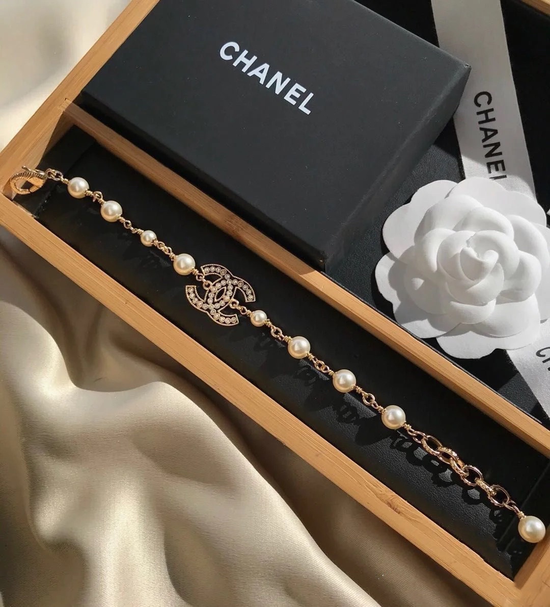 replica Chanel Hollow CC Diamond Paved Pearl Chain Bracelet - H Lin Jewelry