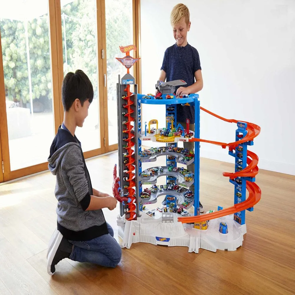 Hot Wheels Track Set with 4 1:64 Scale Toy Cars, Super Ultimate Garage, Over 3-Feet Tall