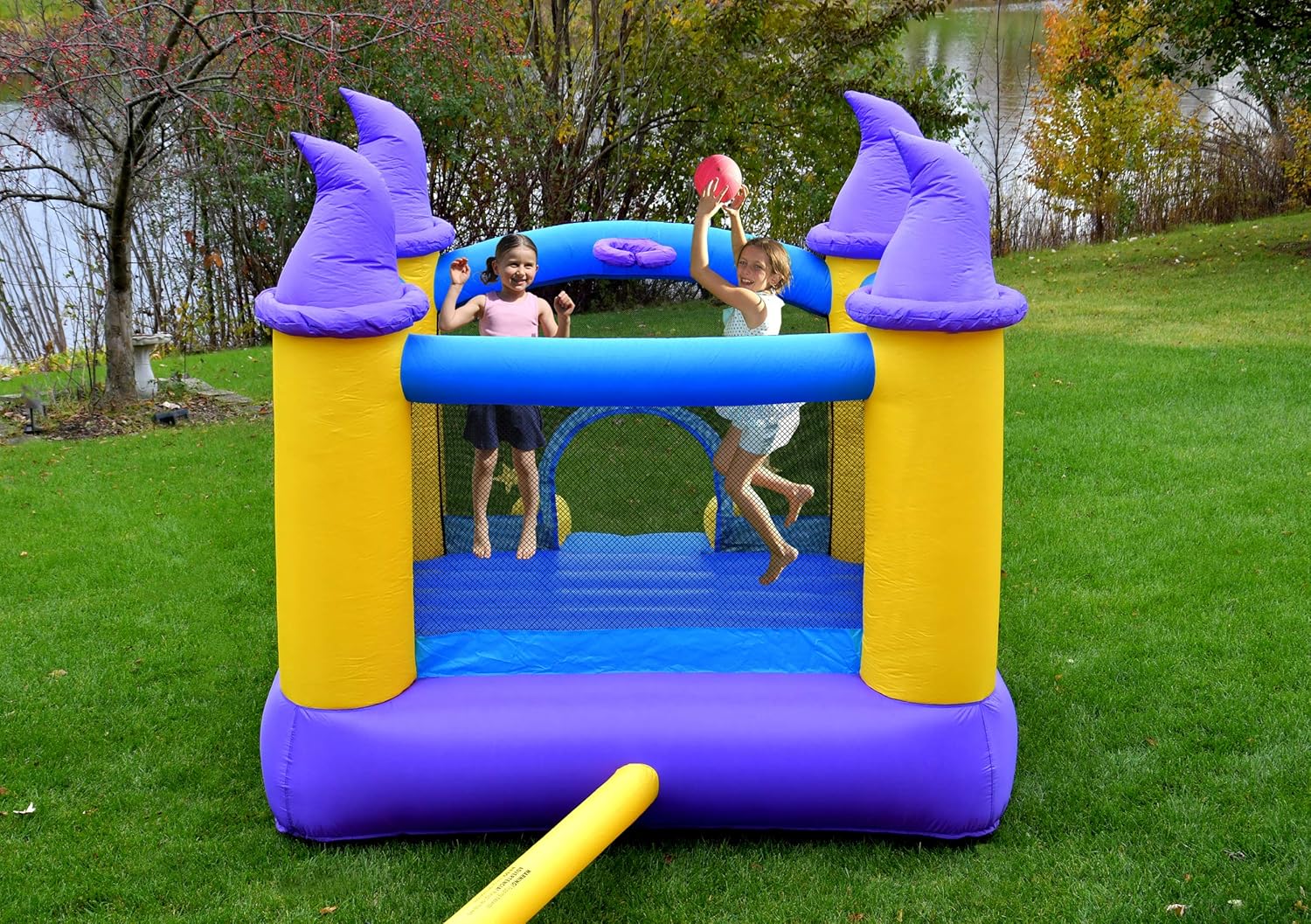 Wizard Inflatable Bounce House Bouncer, Spacious Bouncing Area with Fun Slide, Safe hook-and-loop fastener Entrance, Basketball Hoop, Fun Party Wizard Castle Theme, Inflated Size: 9 ft x 8 ft x 7 ft H