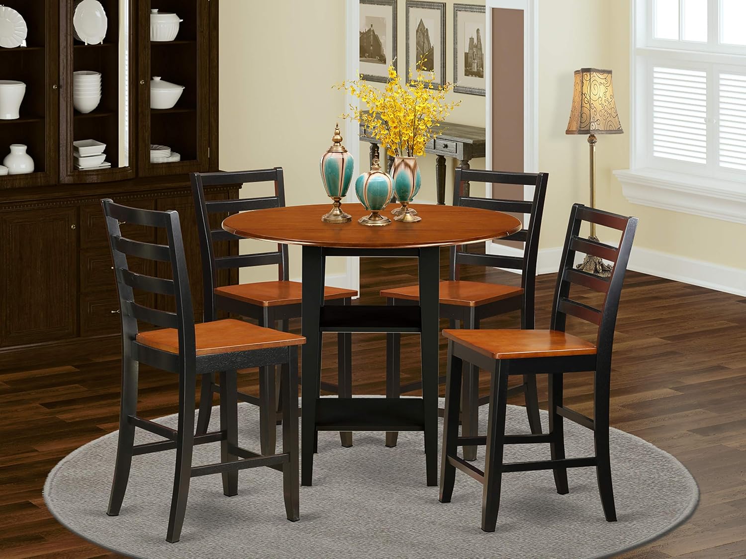 5 Piece Sudbury Set With One Round Counter Height Dinette Table And 4 Ladder Black Dinette Stools With Wood Seat In A Elegant Black and Cherry Finish.