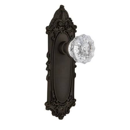 Nostalgic Warehouse 704115 Clear Crystal Passage Door Knob with Victorian Long Plate Finish: Oil-Rubbed Bronze, Backset: 2-3/8x2